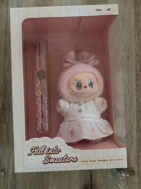 Fall Into Sweaters Pink Plush Baby Doll with Braided Accessory